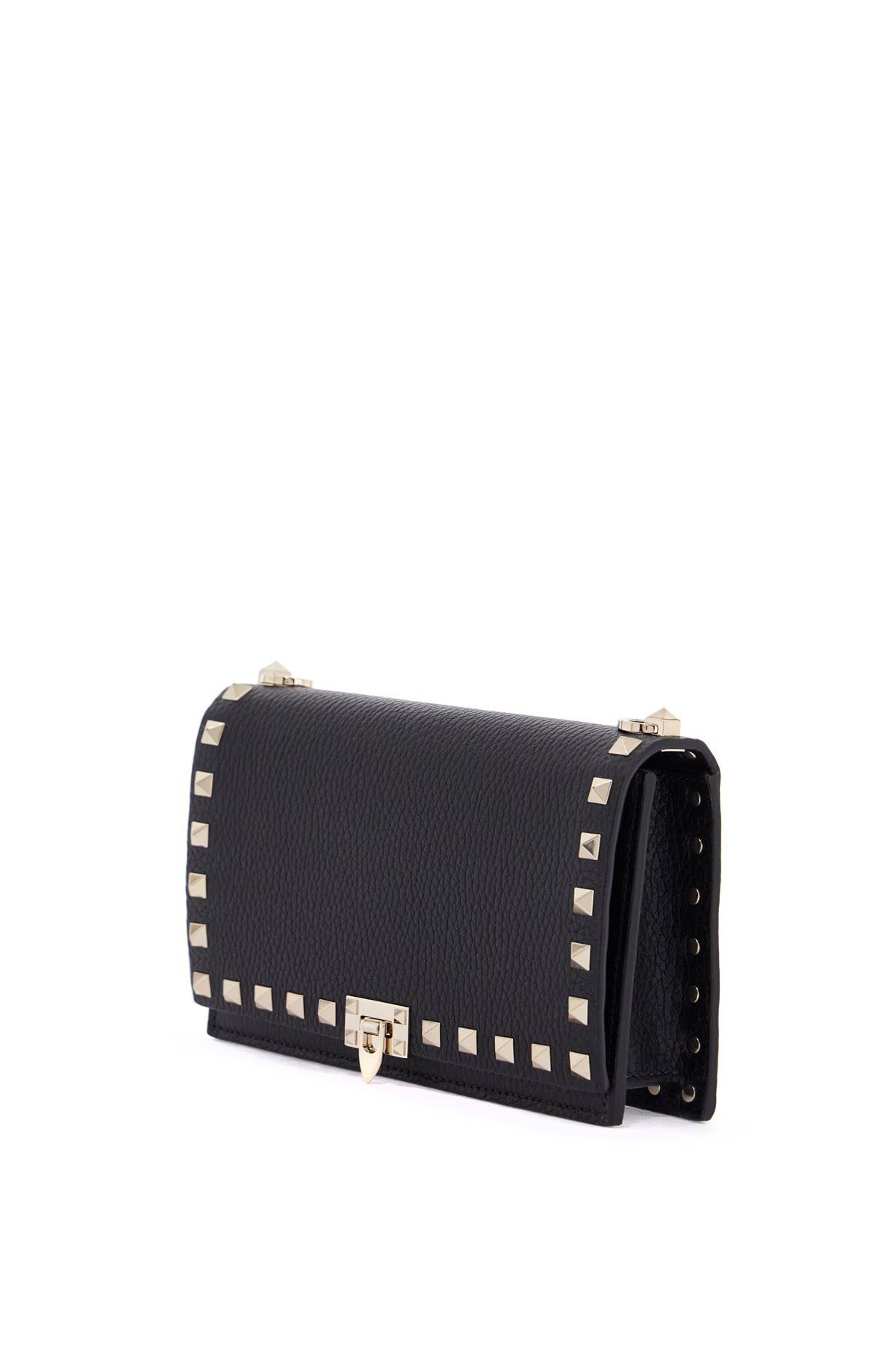 mini black leather bag with golden metal studs