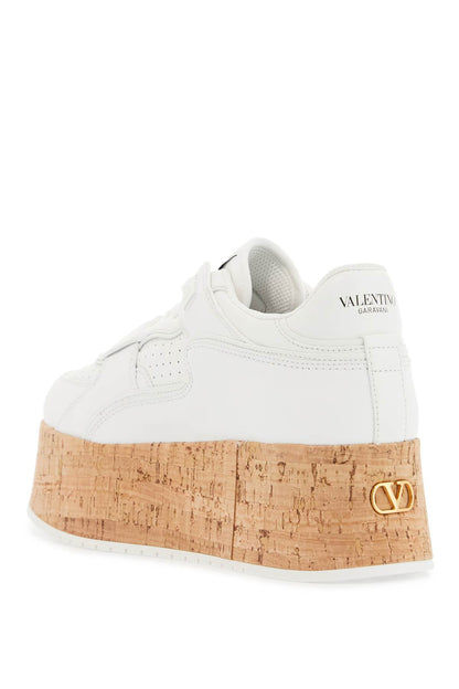 sneaker with cork sole and white leather perforated details