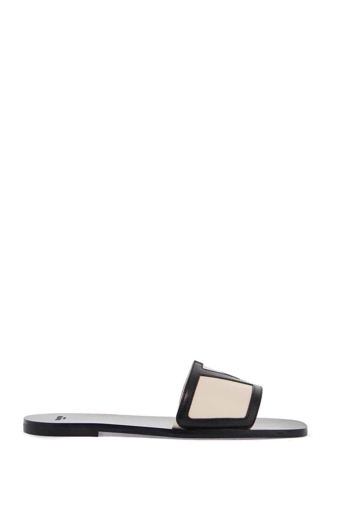 butter white and black synthetic slides with wide strap