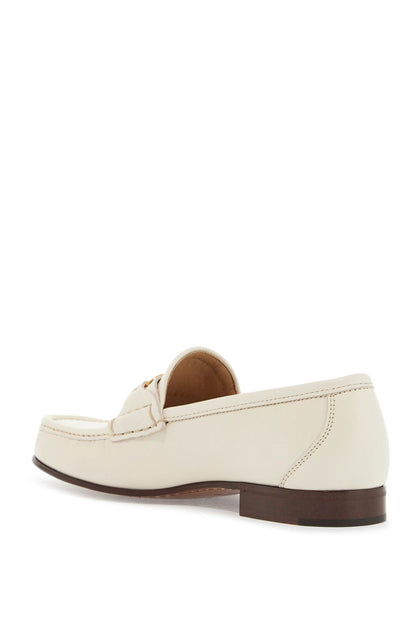 ivory leather loafer with golden metal v logo