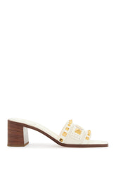 ivory leather slippers with golden studs and low heel