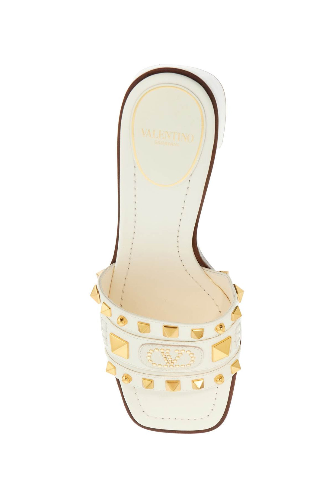 ivory leather slippers with golden studs and low heel