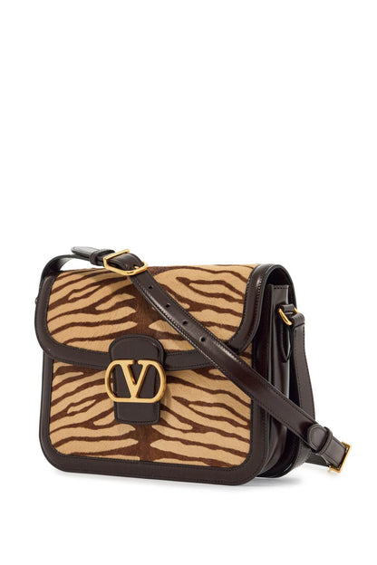 beige and dark brown striped leather shoulder bag