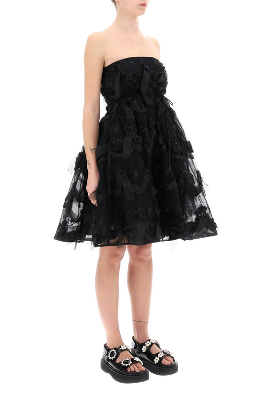 tulle dress with bows and embroidery.