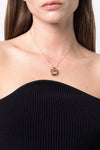 the ferragamo gancini torchon necklace redefines the visual codes of the maiso