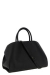 the ferragamo hug m handbag sets new standards of structured luxury through an