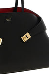 the ferragamo hug m handbag sets new standards of structured luxury through an