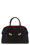 the ferragamo hug m handbag sets new standards of structured luxury through an