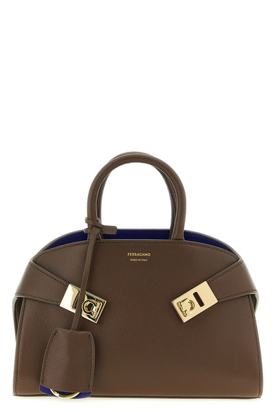 the ferragamo hug bicolor (xs) handbag exemplifies superior italian manufactur