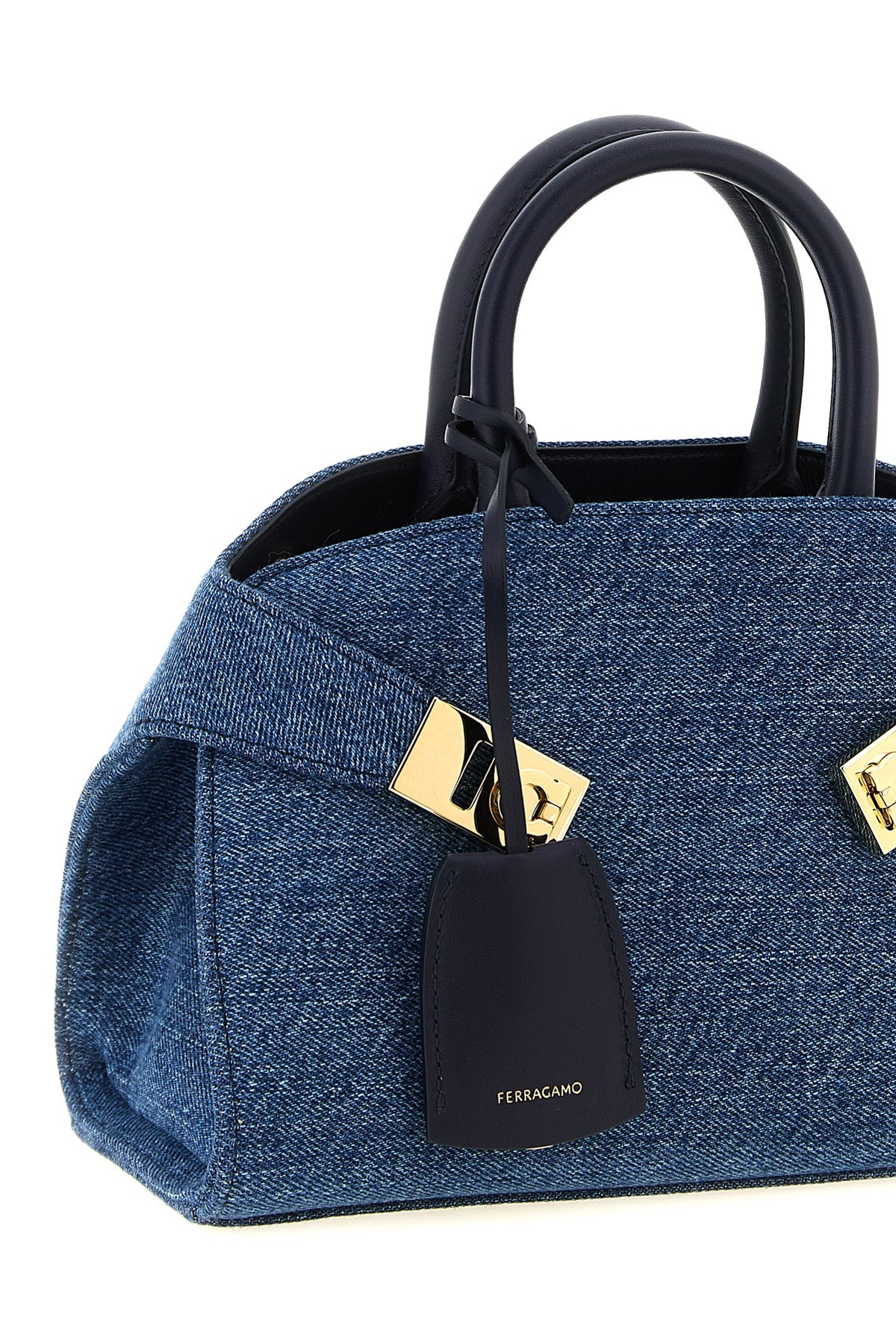 the ferragamo hug (xs) handbag defines a new geometry through a structured sil