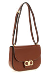 the ferragamo double gancini crossbody bag is made of pure smooth and shiny calf