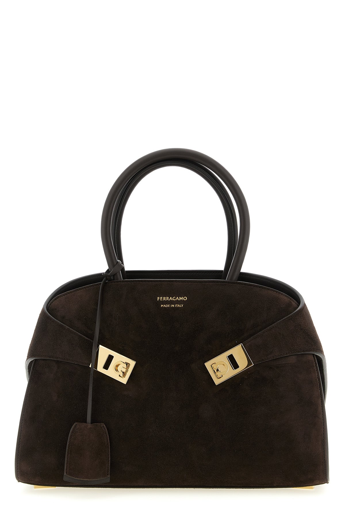 the ferragamo hug th (s) handbag sets new standards in sartorial architecture