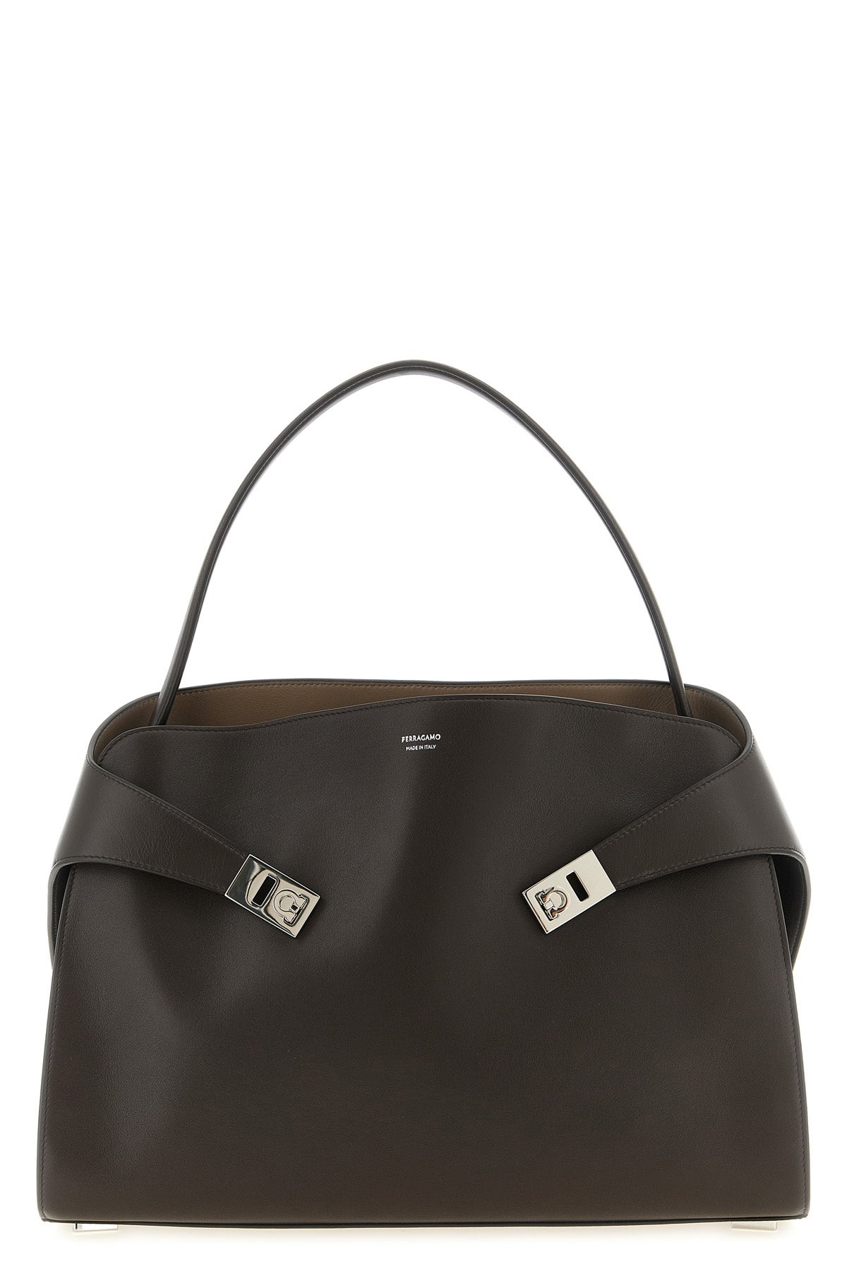 the ferragamo hug soft (l) shoulder bag stands out for its trapezoid silhouett
