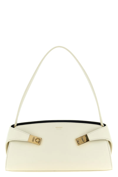 the ferragamo hug east-west shoulder bag in calf leather embodies sculptural e