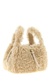 the stella mccartney shoulder bag redefines compact volumes through a sheepskin