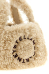 the stella mccartney shoulder bag redefines compact volumes through a sheepskin