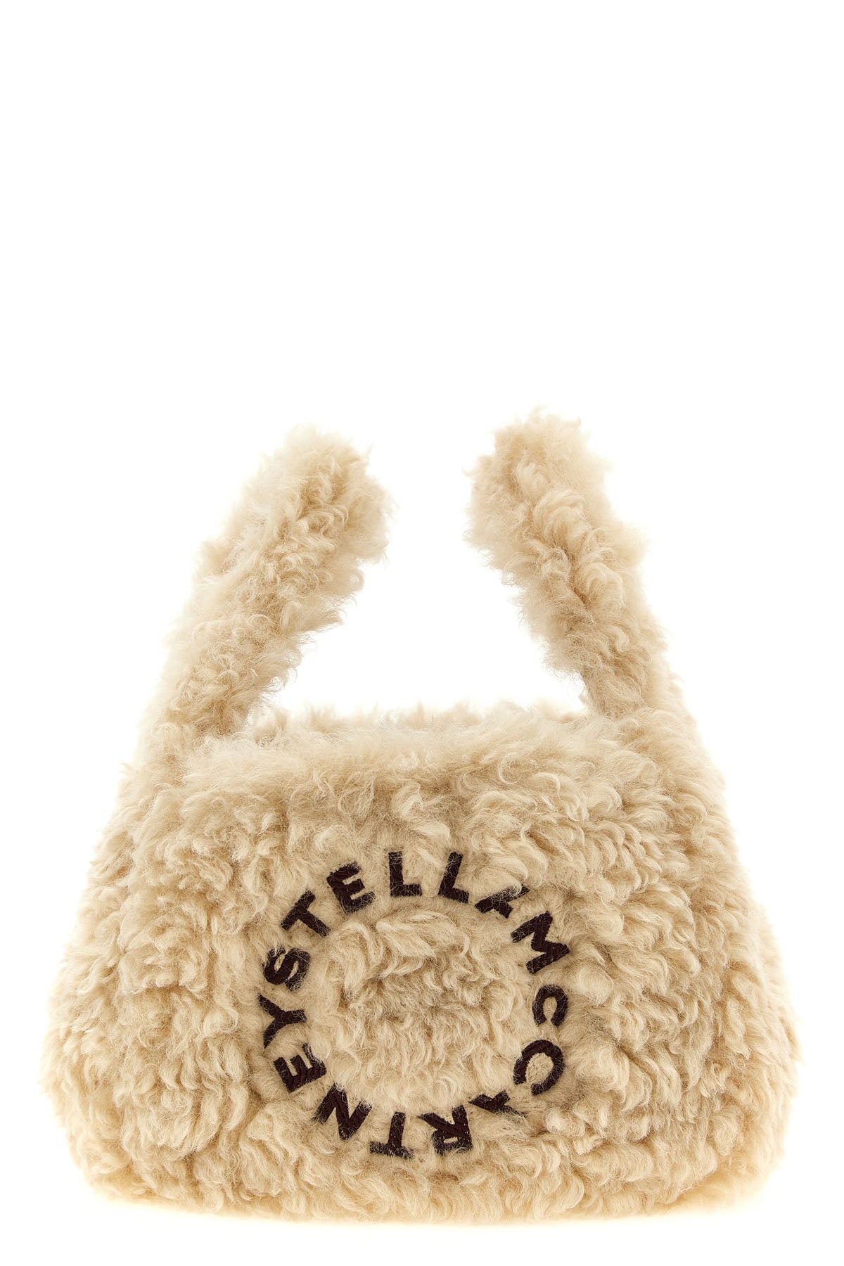 the stella mccartney shoulder bag redefines compact volumes through a sheepskin