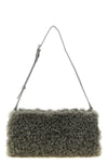 the stella mccartney clutch redefines everyday volumes through a geometric silho