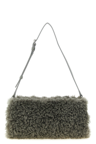 the stella mccartney clutch redefines everyday volumes through a geometric silho