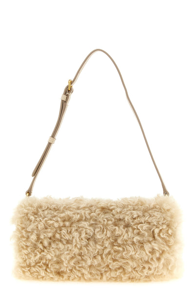 the stella mccartney clutch redefines everyday volumes through a structured cyli