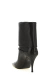 saint laurent niki ankle boots exemplify a rigorous sartorial approach through