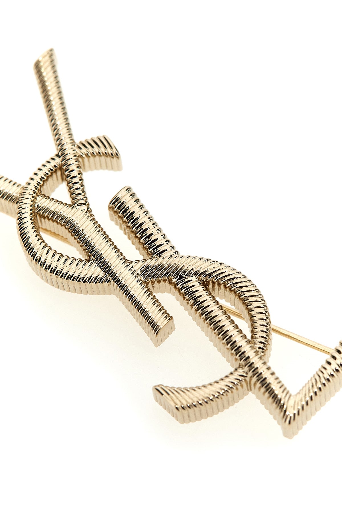 gold metal cassandre brooch