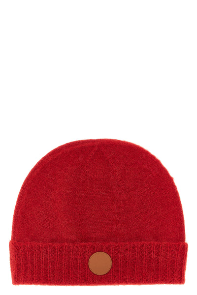 the vivienne westwood cap redefines winter accessories through a rich and envelo
