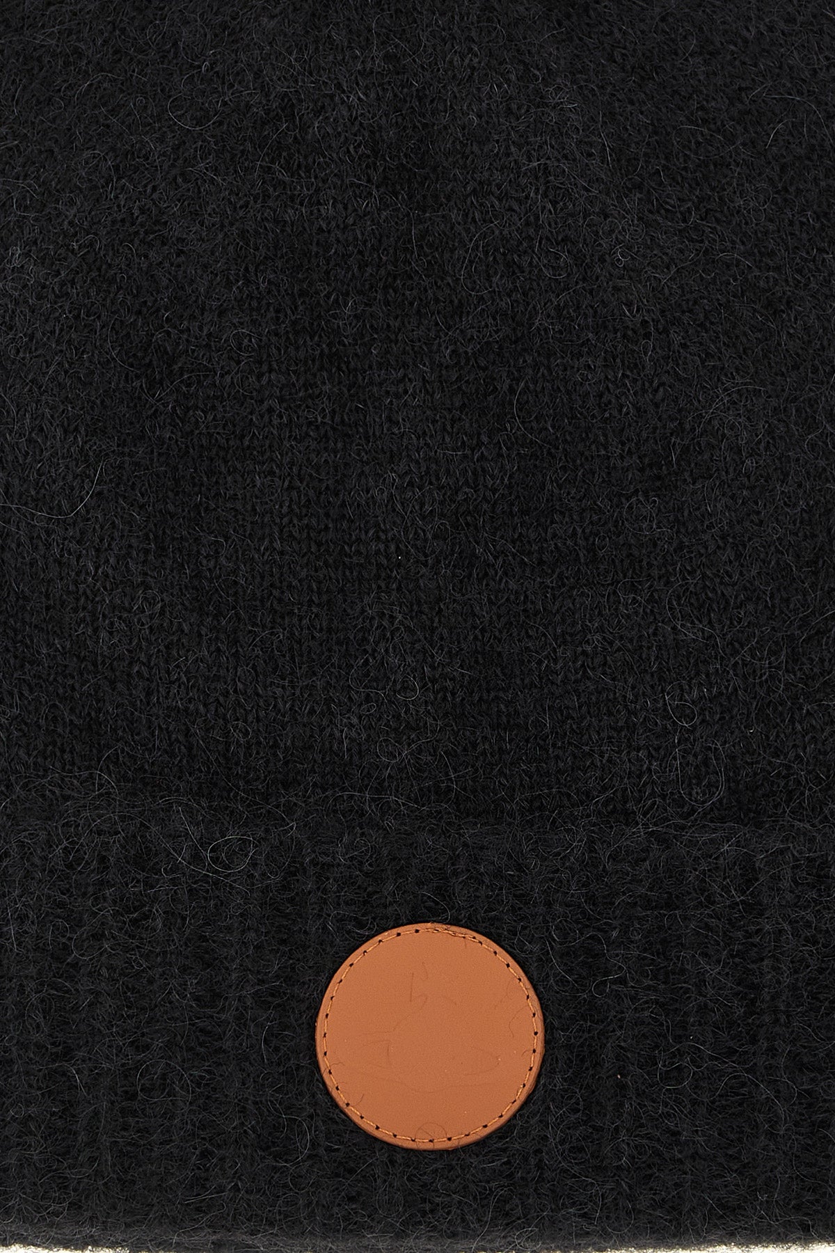 the vivienne westwood cap defines winter aesthetics through enveloping volumes a