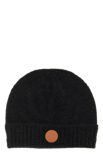 the vivienne westwood cap defines winter aesthetics through enveloping volumes a