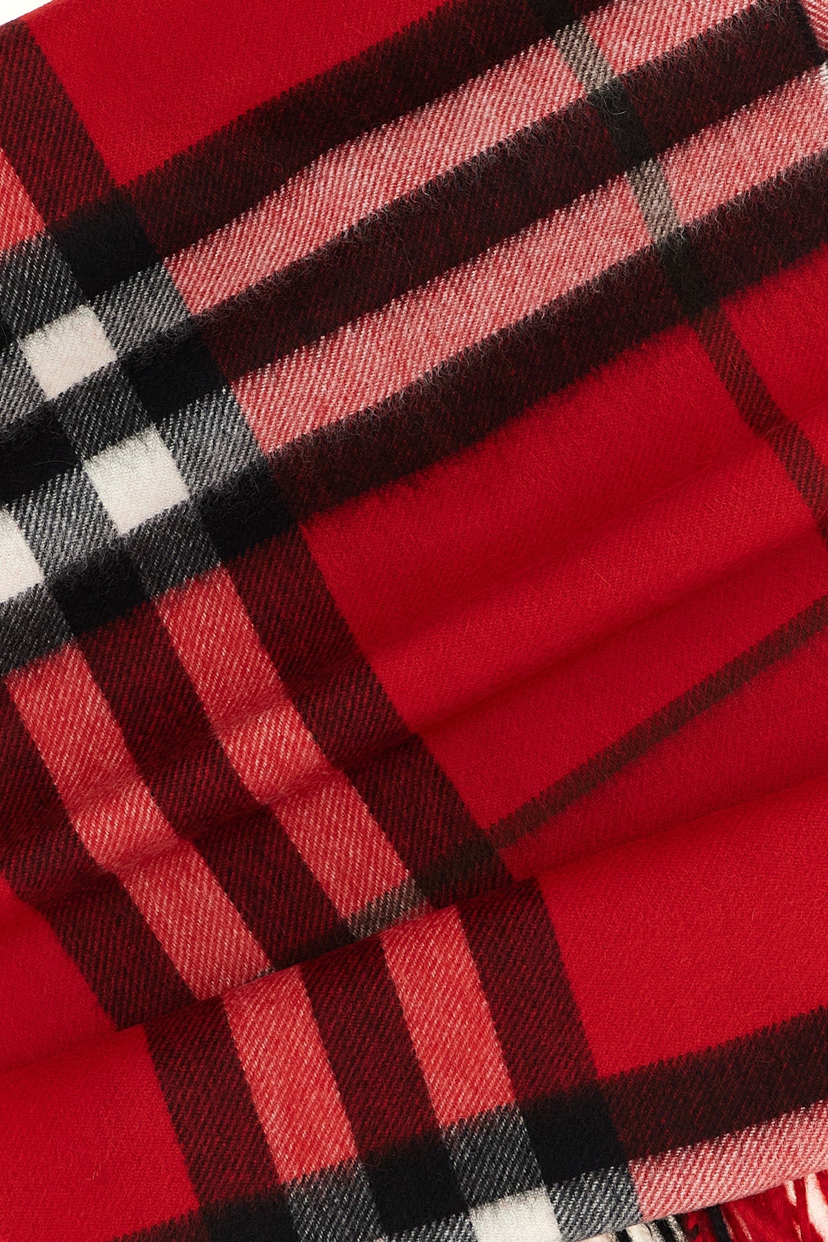 the burberry scarf redefines accessory codes through an enveloping silhouette an