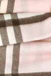 the burberry scarf redefines accessory codes through an enveloping silhouette an