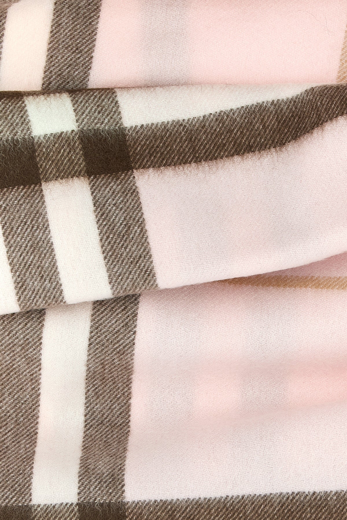 the burberry scarf redefines accessory codes through an enveloping silhouette an