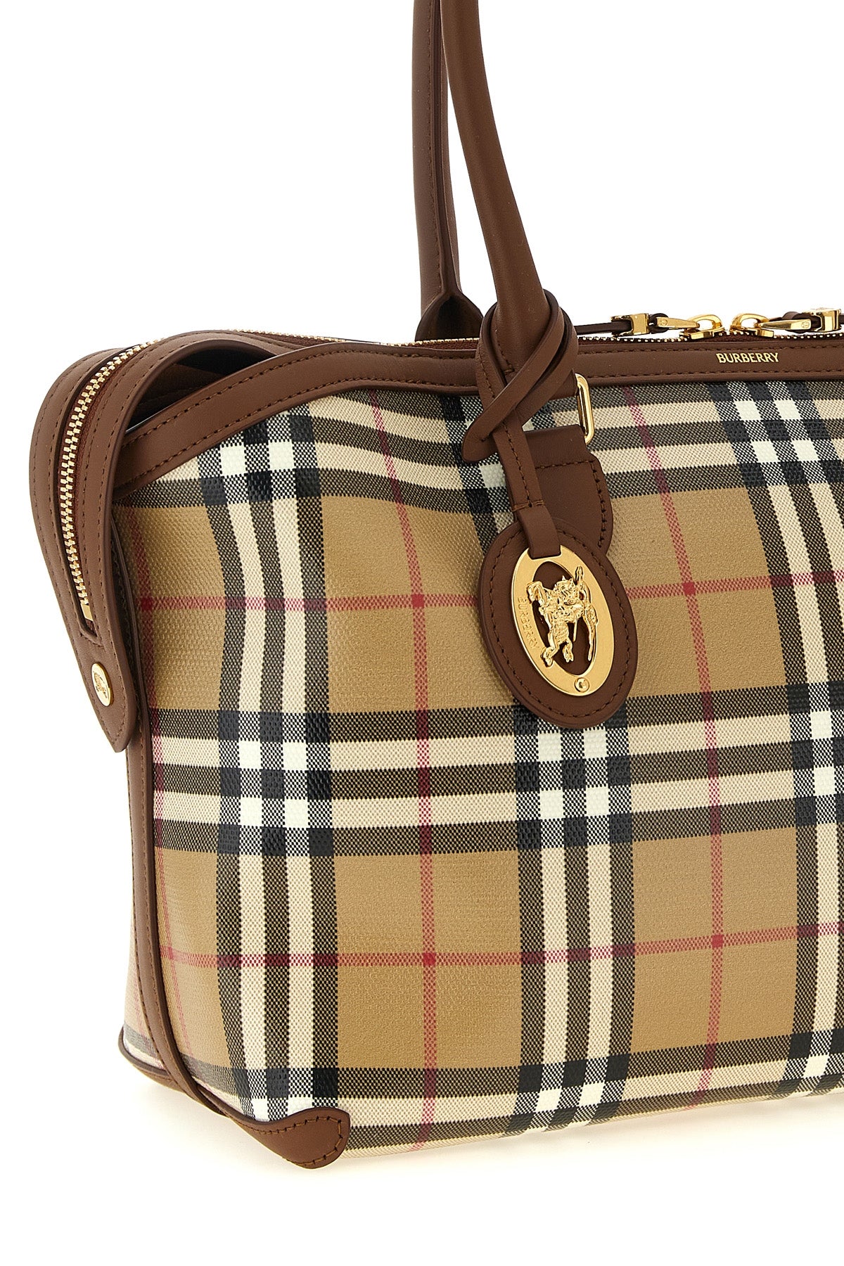the burberry small tote bag features a structured silhouette in coated cotton ca