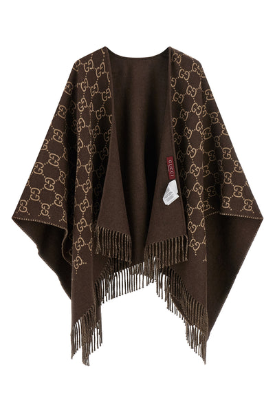 guccis gg jacquard pure wool cape defines a fluid and enveloping silhouette