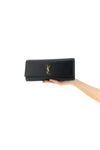 kate grain de poudre leather clutch