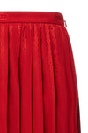 guccis midi skirt defines contemporary elegance through meticulous sartorial co