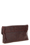 balenciagas le city clutch bag redefines urban elegance through a deconstruct