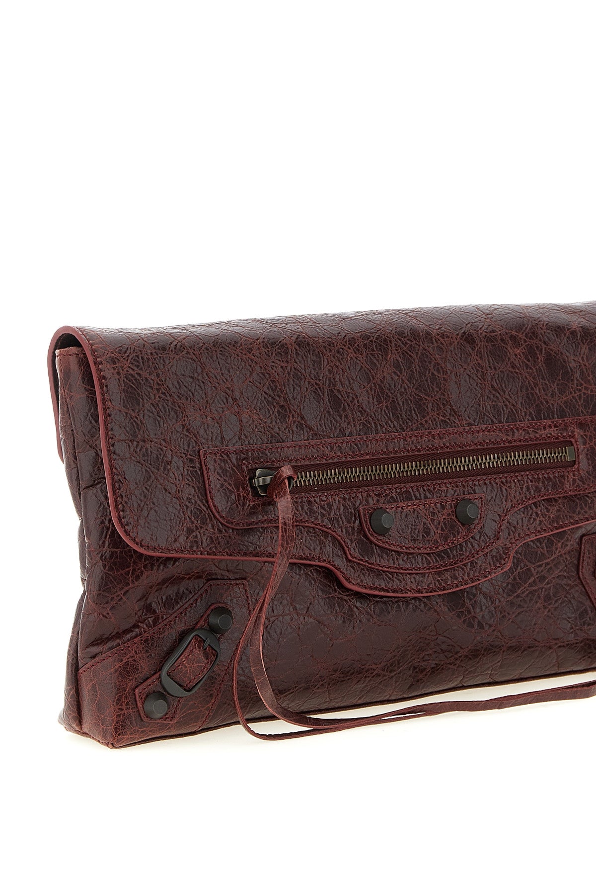 balenciagas le city clutch bag redefines urban elegance through a deconstruct