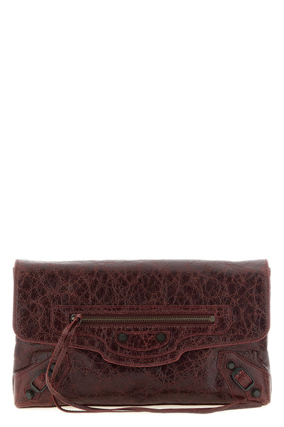 balenciagas le city clutch bag redefines urban elegance through a deconstruct