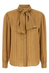 the saint laurent blouse defines fluid elegance through impeccable sartorial con