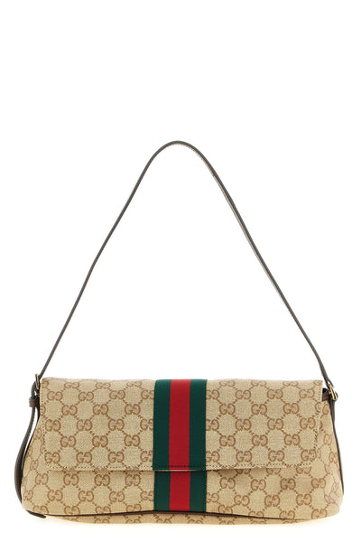 the gucci madison medium shoulder bag defines a structured rectangular silhoue