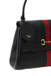 gucci paparazzo midi handbag is made of soft black calf leather