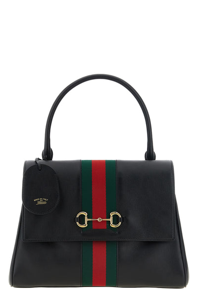 gucci paparazzo midi handbag is made of soft black calf leather