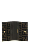 the fendi cardholder is distinguished by a compact folding construction
