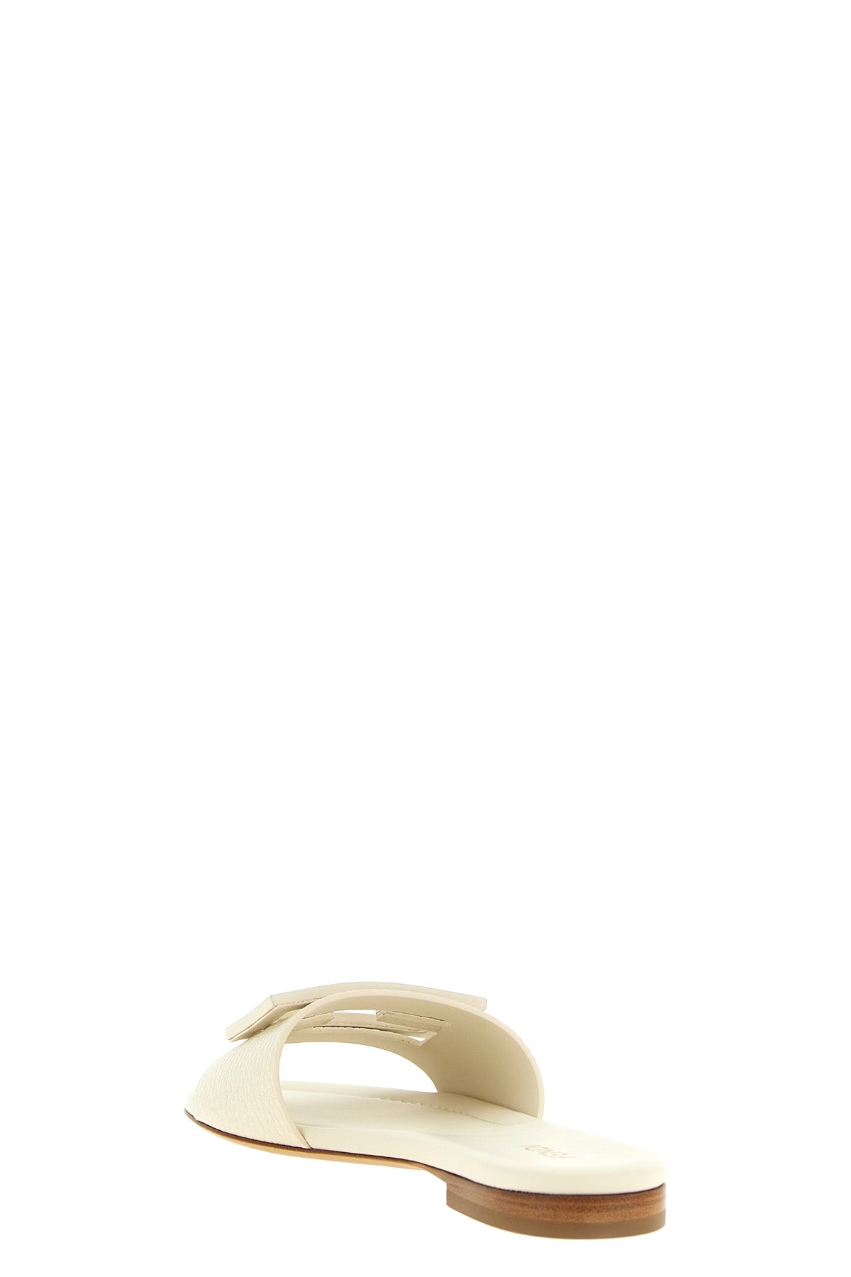 the fendi tube slides embody essential elegance through a flat silhouette