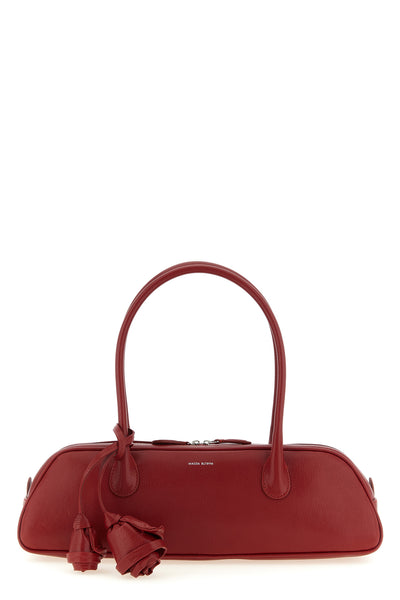 the magda butrym brigitte trapeze handbag defines a new geometry through an el