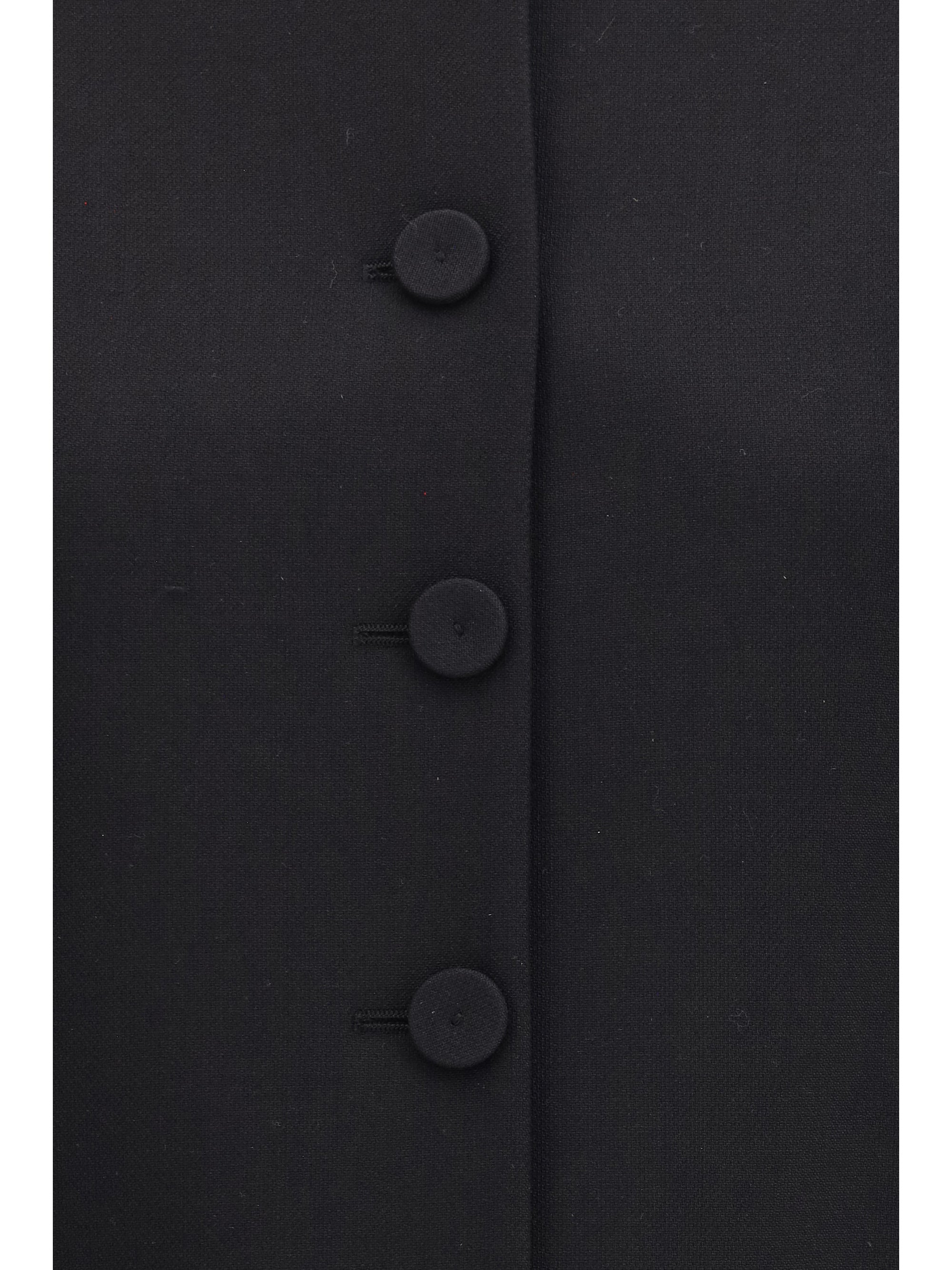 collarless fitted jacket in wool crêpe