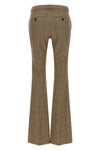 saint laurent flared trousers redefine classic tailoring through a silhouette in