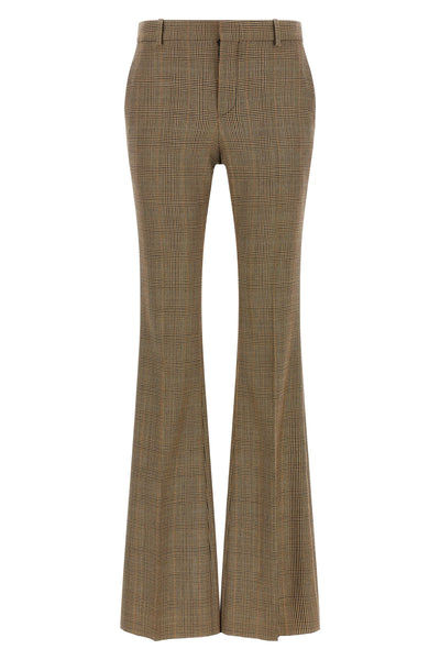 saint laurent flared trousers redefine classic tailoring through a silhouette in