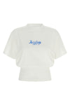 the balenciaga top redefines the proportions of everyday wardrobe through a bold